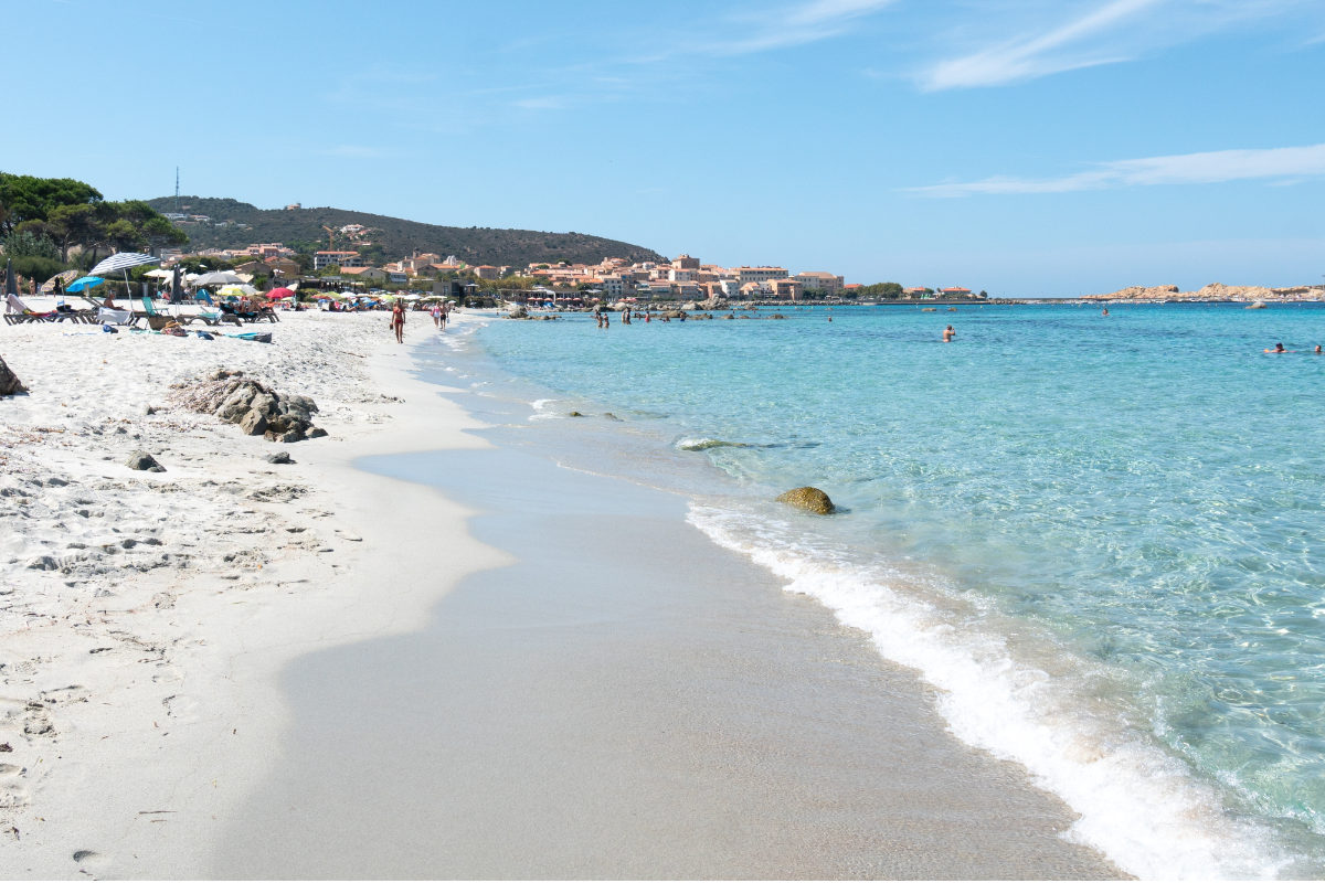 Sandy beach and turquoise water of Calvi Beach in Corsica