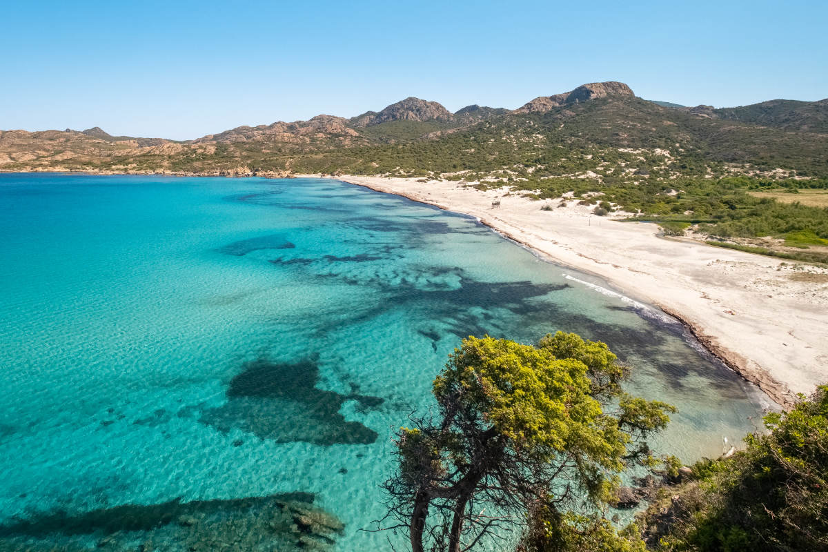 The sandy beach and sheltered cove of Ostriconi in Corsica