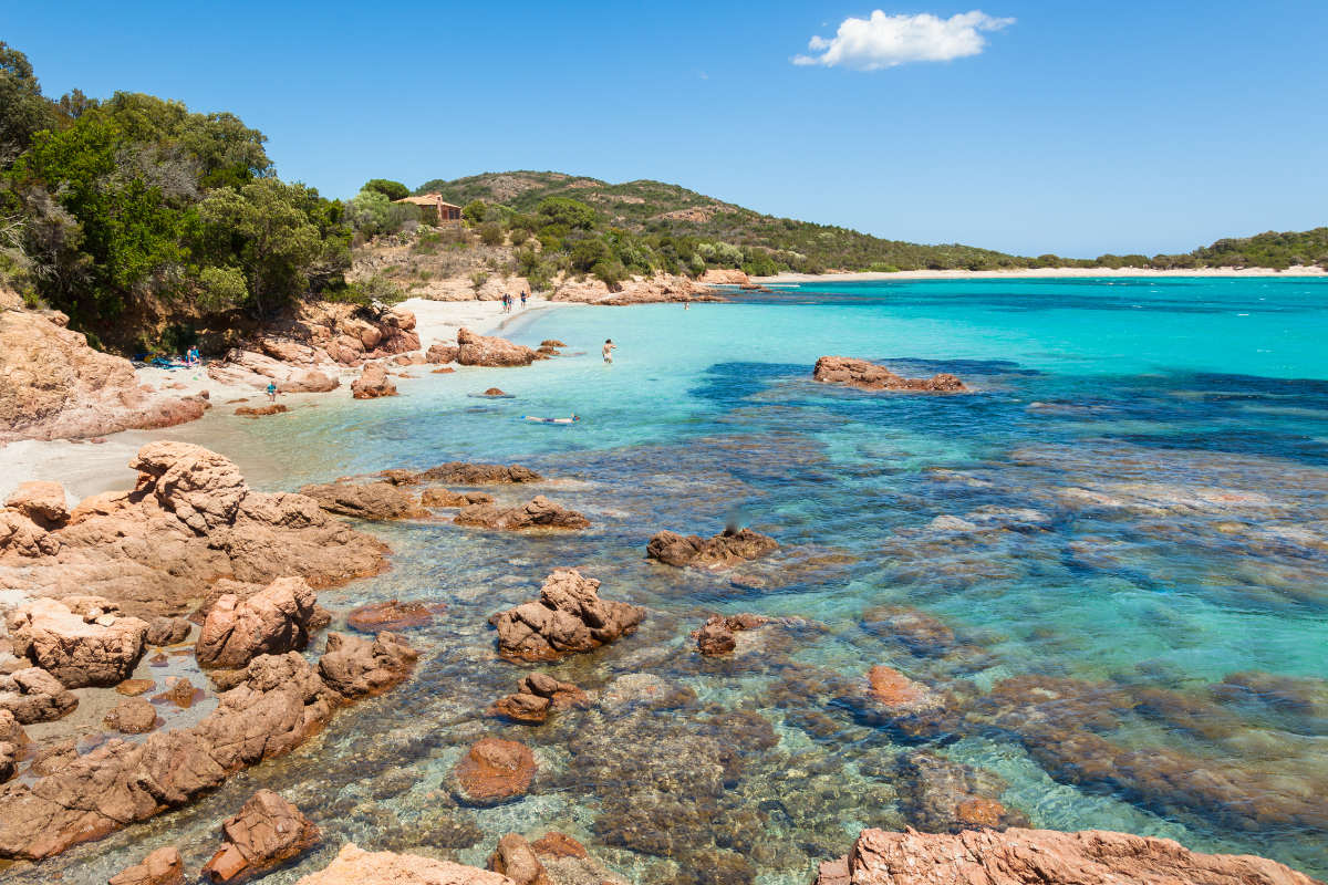 Beautiful bay and beach at Rondinara with crystal clear turquoise waters in Corsica.